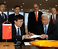 This IEAE photo by D. Calma shows Yang Dazhu, director general of the China Atomic Energy Authority, and Tomihiro Taniguchi, head of the IAEA Department of Nuclear Safety and Security, signing the 2007 agreement.