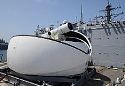 "Our conservative data tells us a shot of directed energy costs under $1," Chief of Naval Research Rear Adm. Matthew Klunder said. (The Laser Weapon System on the guided-missile destroyer USS Dewey in San Diego. U.S. Navy photo by John F. Williams)