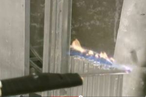 This screen capture from the DARPA video shows someone using the hand-held electrode to suppress small methane flames.