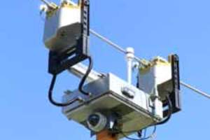 The EPRI Journal article includes this photo of Ti, a robot that inspects transmission lines and collects information that utilities can act on in real time.