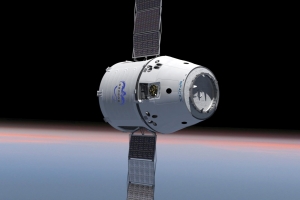 This SpaceX image depicts the Dragon spacecraft with solar arrays unfurled.