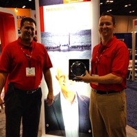 Ken Adam, left, regional account manager, Mid-Atlantic Training Solutions, and Lawrence Short, right, regional account executive, Training Solutions, for DuPont Sustainable Solutions, show off their winning New Product of the Year trophy at the 2012 NSC.