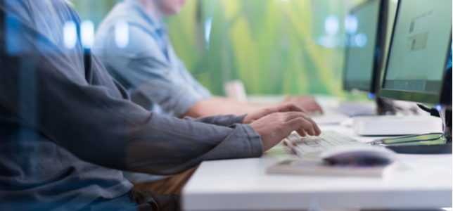 closeup of students working on computers
