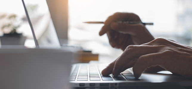 closeup of hands on laptop