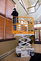 Low-level access lifts won't damage carpet and can maneuver into tight spaces, elevators, and offices. (Custom Equipment image)