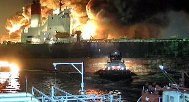 This photo shows the fire following the Houston Ship Channel accident. (Image from NTSB Marine Brief, courtesy of ITC City Dock security video)