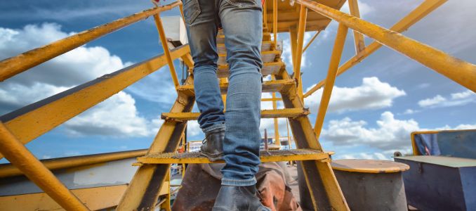 Worker Climbing a Ladder 