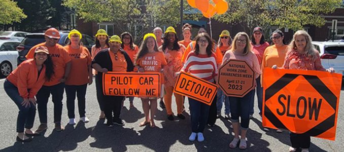 Group photo of people wearing orange