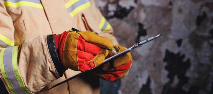 Fireman holding clipboard