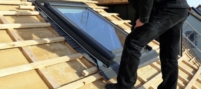 Roofer Installing Skylight