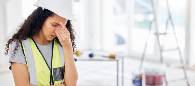Stressed construction worker