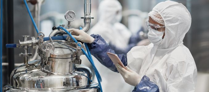 portrait of female worker wearing protective suit