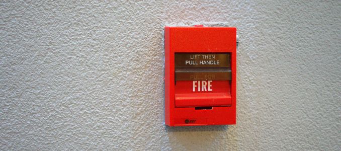 Fire alarm on white wall
