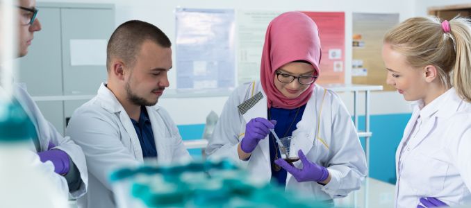 group of scientists working at the laboratory