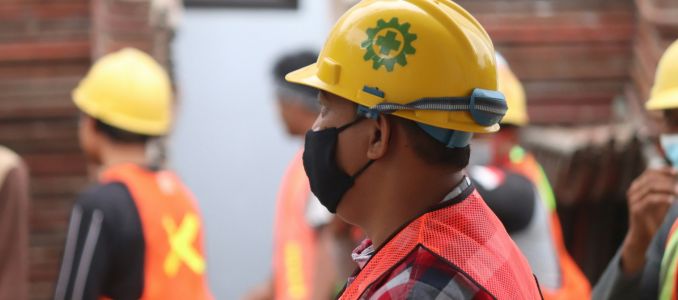 Workers wearing hard hats