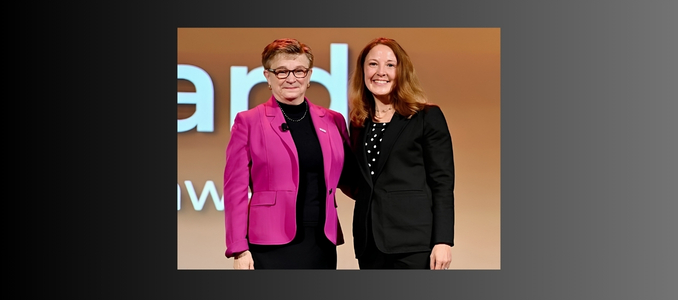 Karen LaRue receives the 2026 Marion Martin Award from a National Safety Council presenter on stage, with both women smiling while posing side by side.