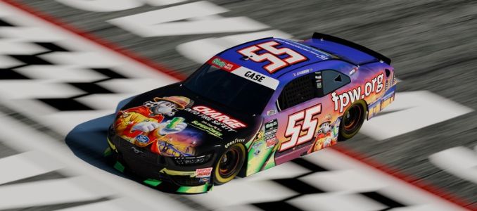 No. 55 race car with fire prevention graphics crosses a checkered finish line.