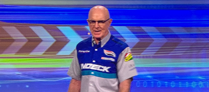 Former professional race car driver Derek Daly speaking on stage at the National Safety Council (NSC) Safety Congress & Expo.