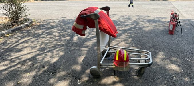 A utility trolley holding a firefighter