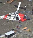 Helicopter rescue of a Hurricane Katrina victim.