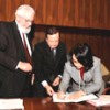 This photograph shows International Labour Organization Director-General Juan Somavia, left, at the March 25 signing of the list.