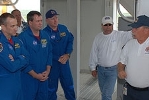 This photo (NASA/Jim Grossman) shows Hoggard, right, discussing emergency procedures with the crew of STS-129, commanded by Charles Hobaugh, left.