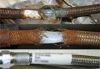 The hose that failed, shown at the top in this CSB photo, had been in service for seven months and was susceptible to corrosion from phosgene, according to the agency.