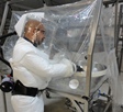 This is an example of the combined use of respiratory protective equipment and a flexible enclosure as a containment device.