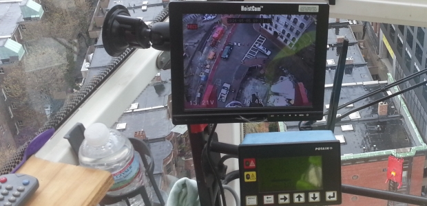A monitor inside the cab of a tower crane provides the operator with close-up view of the load and lifting area. (Netarus, LLC photo)