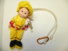 The doll pictured here was found in a dollar store, and all I did was tie some rope to simulate the harness and lanyard.