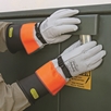 Rubber insulating gloves and leather protector gloves help keep workers safe any time they are exposed to energized parts. (Ansell Protective Products Inc. photo)