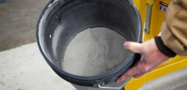 Dust collection systems include a shroud that surrounds the drill bit and connects to a hose leading to a dust canister, where collected dust is stored. (E-Z Drill photo)
