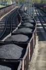 a loaded coal train moves at a mine site