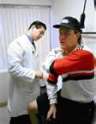 doctor treating injured worker