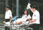 EMTs transporting an injured patient