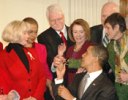 President Obama hands a pen to Rep. George Miller after signing Ledbetter bill