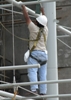 this worker wears a full-body harness with a lanyard