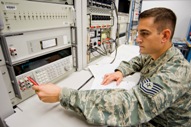 This U.S. Air Force photo by Abner Guzman shows Tech Sgt. Eric Rozzanno of the 62nd Maintenance Squadron calibrating a voltage standard.