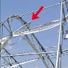 The arrow in this NIST image shows buckling of the steel frame of the Dallas Cowboys practice facility.
