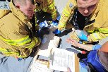 This FDNY photo, taken during an EMS Week 2009 competition on May 21, 2009, shows EMTs treating a simulated victim of cardiac arrest.