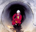 This BW Technologies by Honeywell photo shows a confined space entrant who is wearing a multi-gas detector.