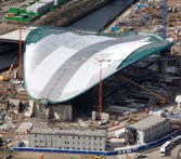 Taken April 1, 2010, this London 2012 photo shows work in progress to line the roof of the Aquatics Centre.