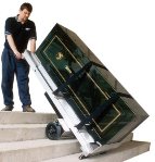 This L.P. International Inc. photo show its PowerMate stair climbing hand truck in action.