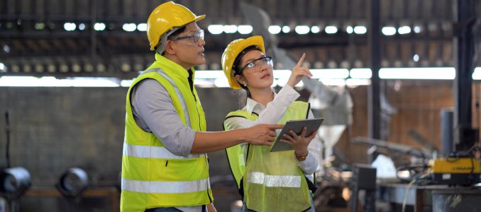 Two safety workers having a discussion