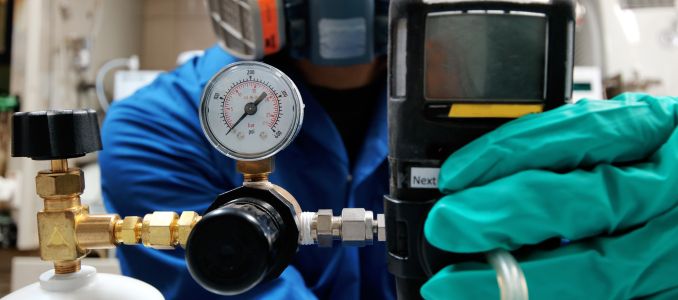 Worker using Gas Detector Monitor