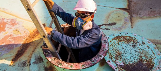 Worker Entering a Confined Space