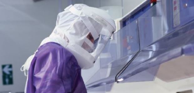 This photograph of a laboratory worker wearing protective gear is included in the CDC report. (CDC image)