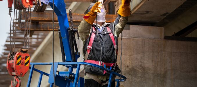 Welder on an elevated platform
