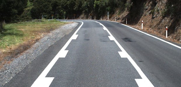 The lane markings are intended to persuade motorcyclists to slow down when entering curves. (New Zealand Transport Agency photo)
