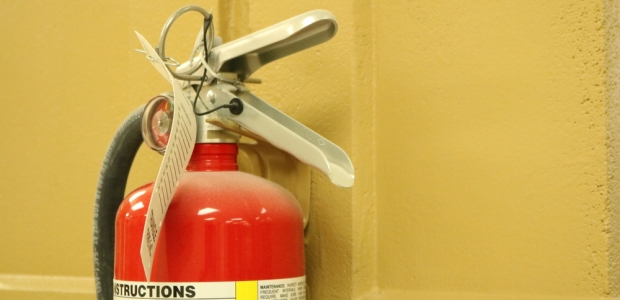 Most building codes require fire extinguishers; because they need to be checked monthly, most are fully charged and ready to use. However, whether or not employees should actually use them is sometimes a debate.